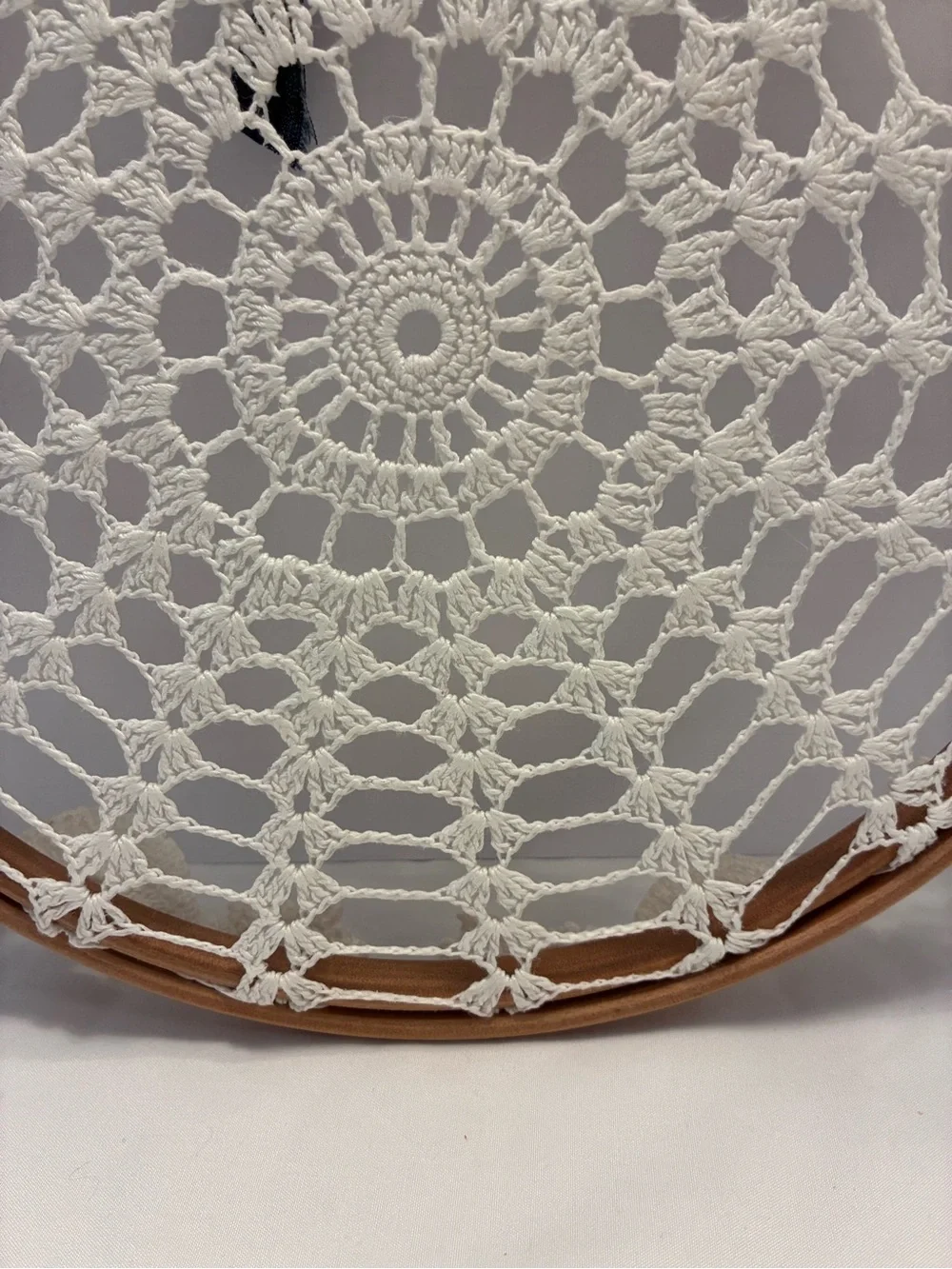 Handmade 10” crochet doily stretched inside a wooden embroidery hoop